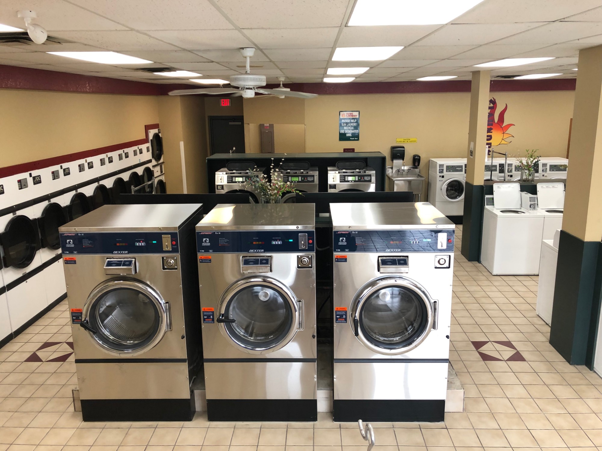 Three brand-new stainless steel giant washers at Sun Laundry Hartland